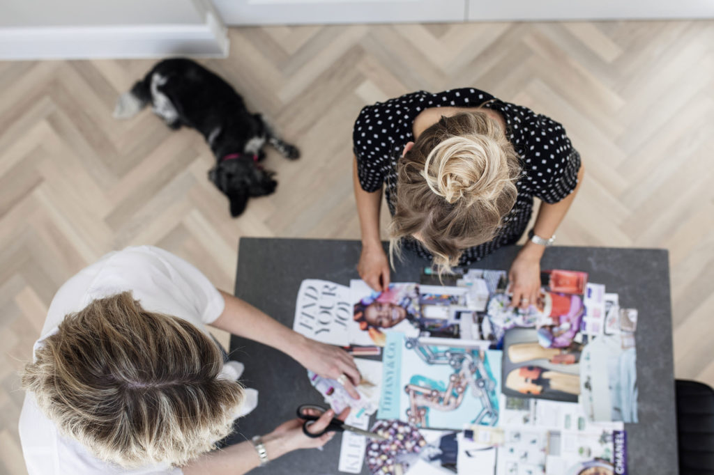 Business ladies making mood-board for a brandshoot.